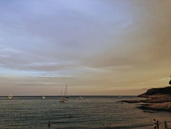 Scenic view of sea against sky at dusk