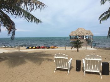 Lifeguard hut on beach against sky