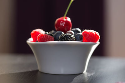 Close-up of fruits in bowl on table