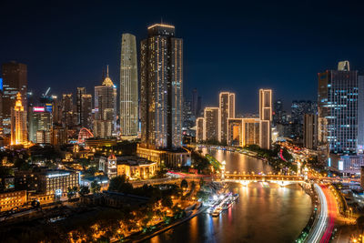 Illuminated buildings in city at night