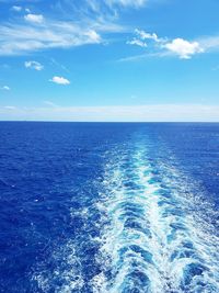 Scenic view of sea against blue sky