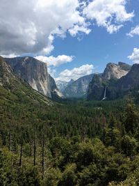 Scenic view of mountains against cloudy sky