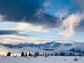 Panoramic view of snowcapped mountains against sky