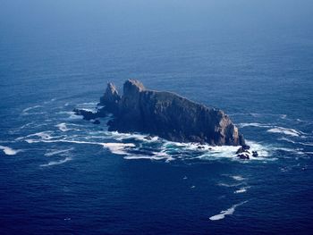 High angle view of rock formation in sea