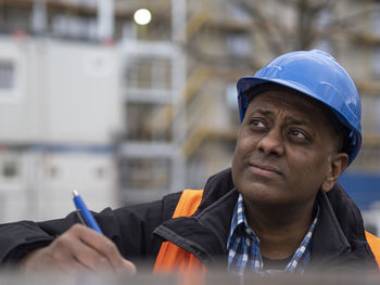 Portrait of young man working at construction site