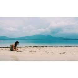 Scenic view of sea against cloudy sky