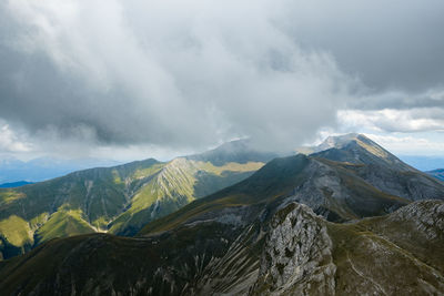 Scenic view of mountains against sky in montemonaco, marche italy