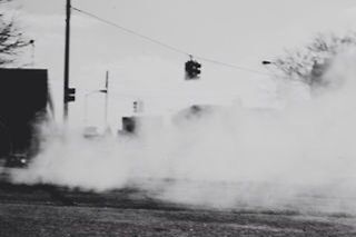 selective focus, transportation, surface level, sky, road, street, focus on foreground, weather, day, outdoors, power line, no people, built structure, rain, nature, dusk, defocused, architecture, focus on background, building exterior