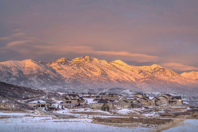 Scenic view of snowcapped mountains against sky during winter