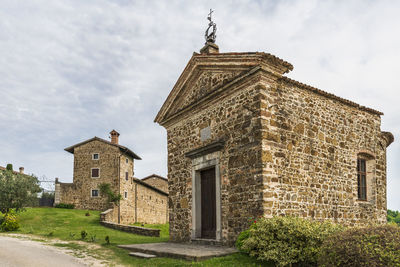 Low angle view of old building against sky