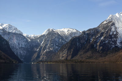 Scenic view of snowcapped mountains against clear sky