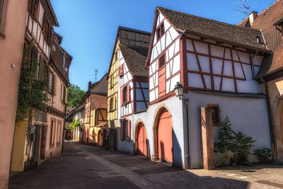 Small alleyway with alsatian half timbered houses built along. taken in colmar, france