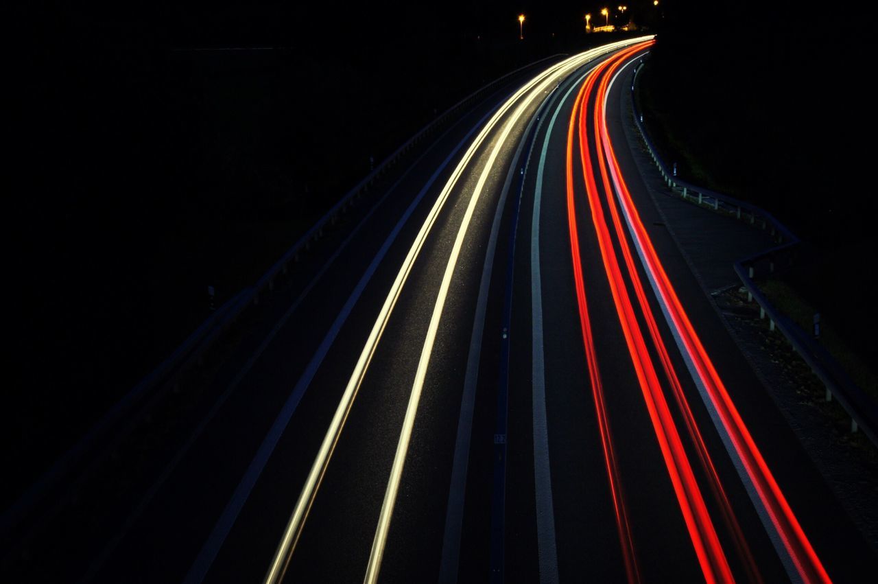night, illuminated, light trail, long exposure, transportation, speed, motion, road, red, blurred motion, multi colored, traffic, highway, tail light, street, high angle view, road marking, the way forward, diminishing perspective, city