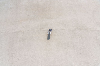 High angle view of footprints on sand at beach