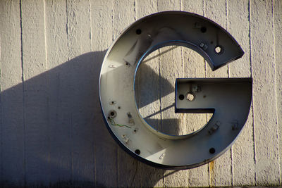Close-up of circular object on wall