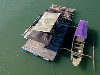 High angle view of a boats moored to wooden pontoon.