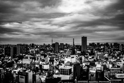 High angle view of modern buildings in city against sky
