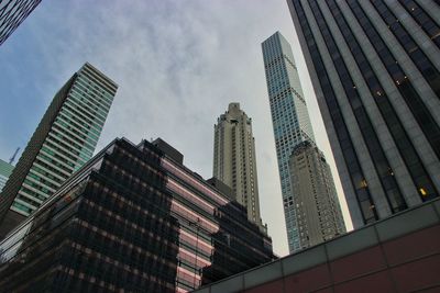 Low angle view of modern buildings against sky in city