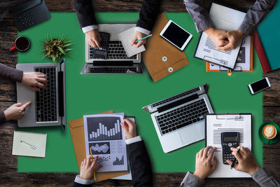 High angle view of business people working at desk