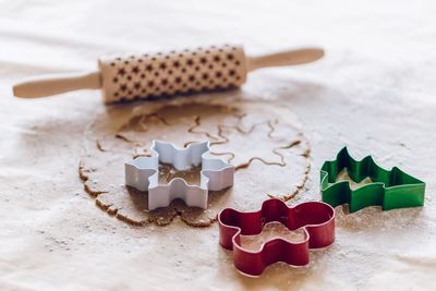 Close-up of pastry cutters on dough