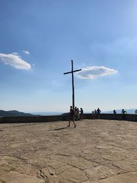 Men on road against sky