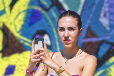 Young woman using mobile phone