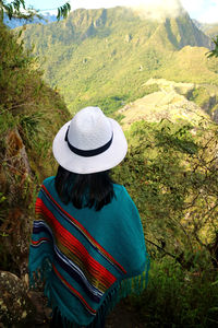 Rear view of woman looking at mountains