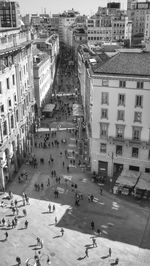 High angle view of people on road against buildings in city