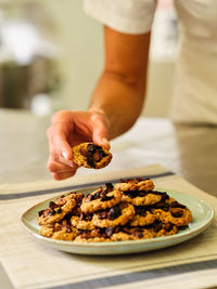 Midsection of man preparing food on table