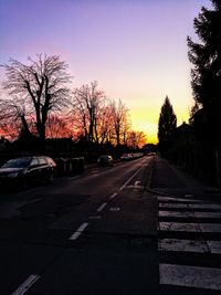 Silhouette of trees in city against clear sky