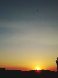 Scenic view of silhouette landscape against clear sky during sunset