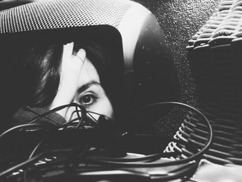 Close-up portrait of young woman in car