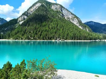 Scenic view of lake and mountains against sky, braies lake, dolomites unesco heritage