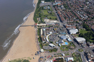 High angle view of buildings and sea seen from airplane