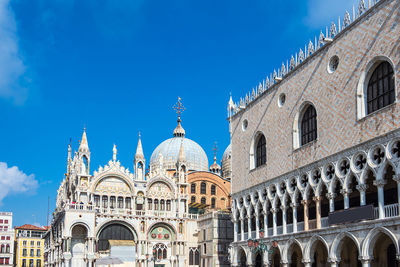 View of buildings against blue sky