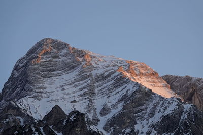 Scenic view of snowcapped mountains against clear sky