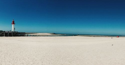 Scenic view of beach against clear sky