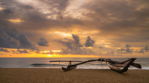 Scenic view of sea against dramatic sky