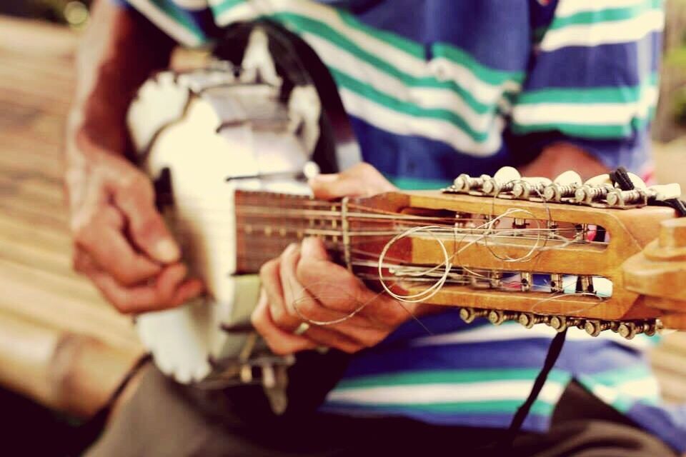 music, playing, guitar, musical instrument, midsection, real people, human hand, plucking an instrument, skill, arts culture and entertainment, musician, indoors, performance, close-up, one person, day, people