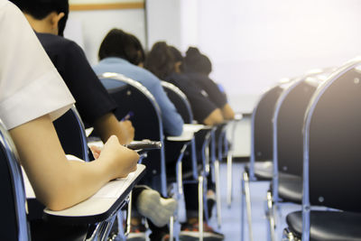 Students giving exam test in university