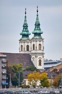 Buildings in city against sky