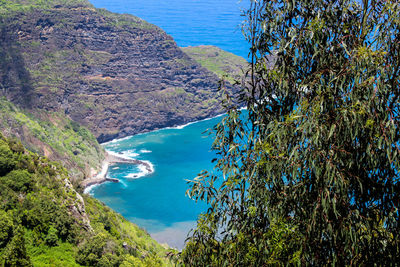 High angle view of bay against clear blue sky