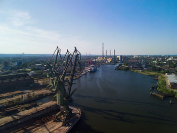 High angle view of river amidst buildings against sky