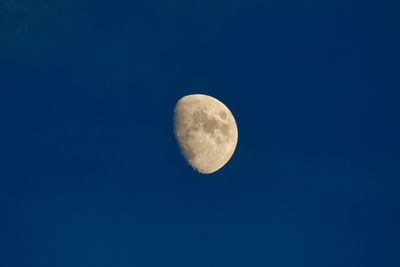 Low angle view of moon against clear sky at night