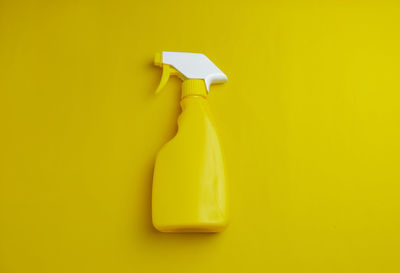 Close up spray bottle in yellow color