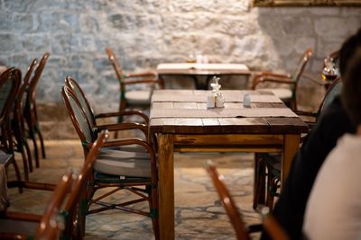 Empty chairs and table in cafe