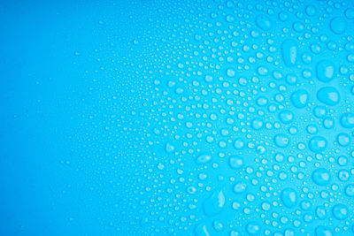 Water drops on blue background.