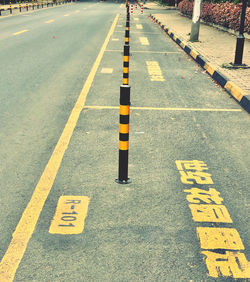 High angle view of arrow sign on road