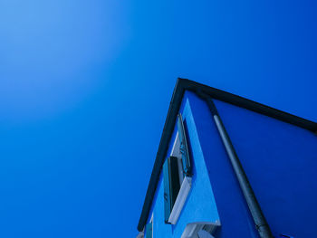 Low angle view of building against blue sky