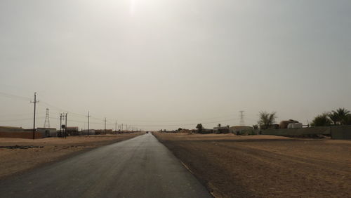 Empty road along landscape